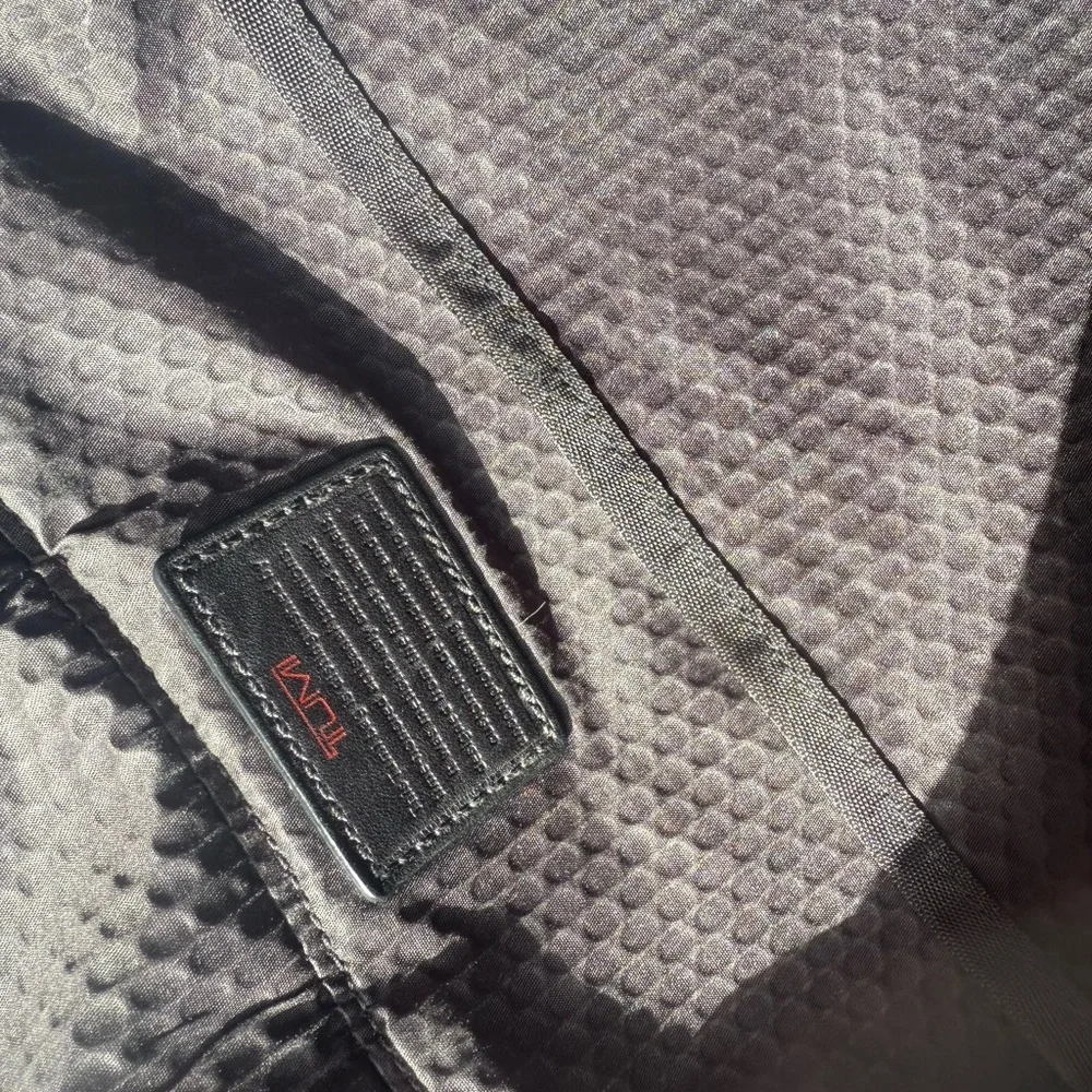 TUMI MESSENGER BAG.